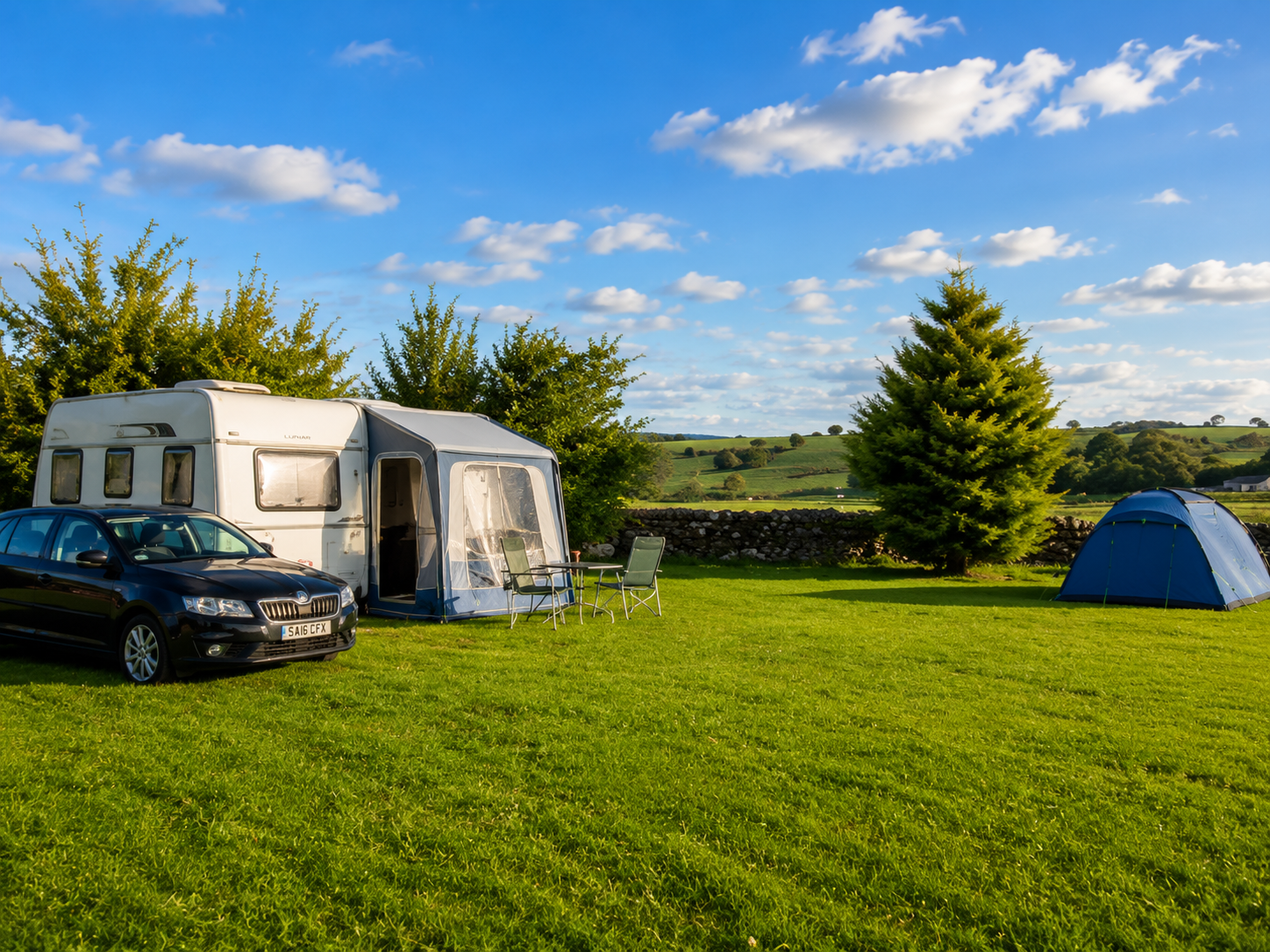 Wide view across the touring field at Collierhall Farm